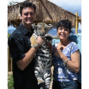 Lorie with magician Rick Thomas and XanGo the Kitty.